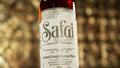 A close up of a Safai Bourbon bottle